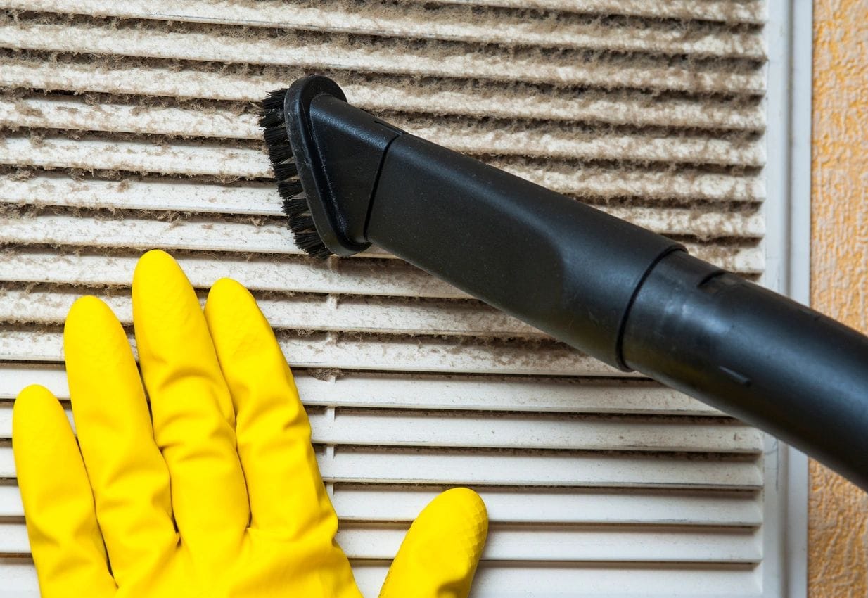 High dusting and ceiling cleaning in a warehouse to remove dust and debris.