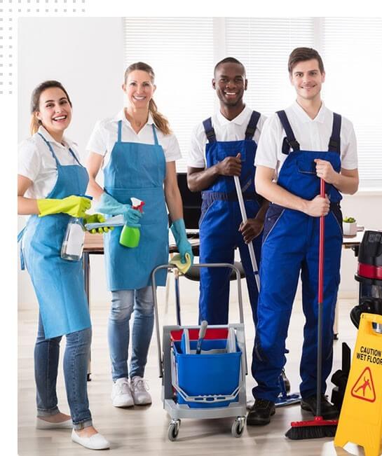 A team of professional cleaners with cleaning equipment, ready for commercial floor cleaning services.