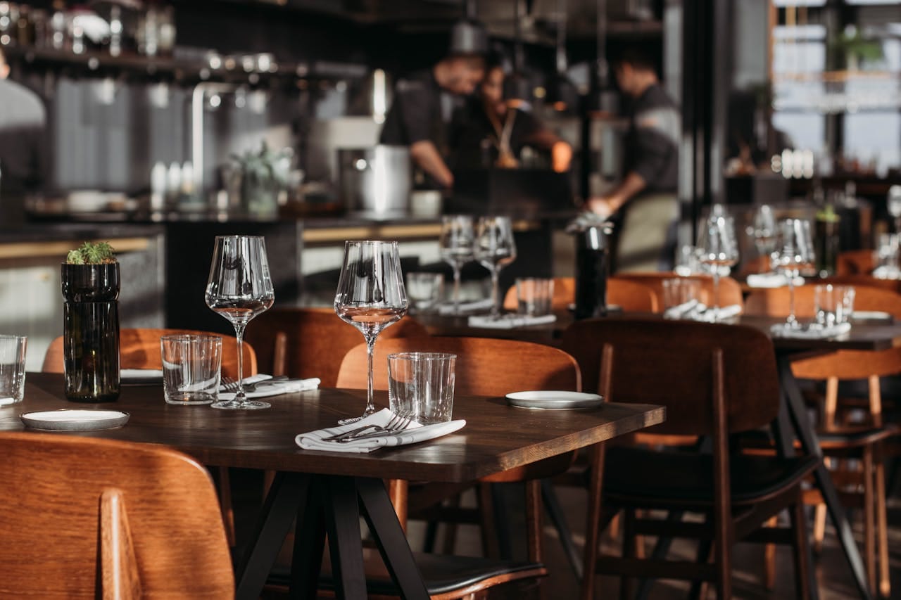 Clean restaurant dining table with polished glassware and place settings ready for guests in Seattle