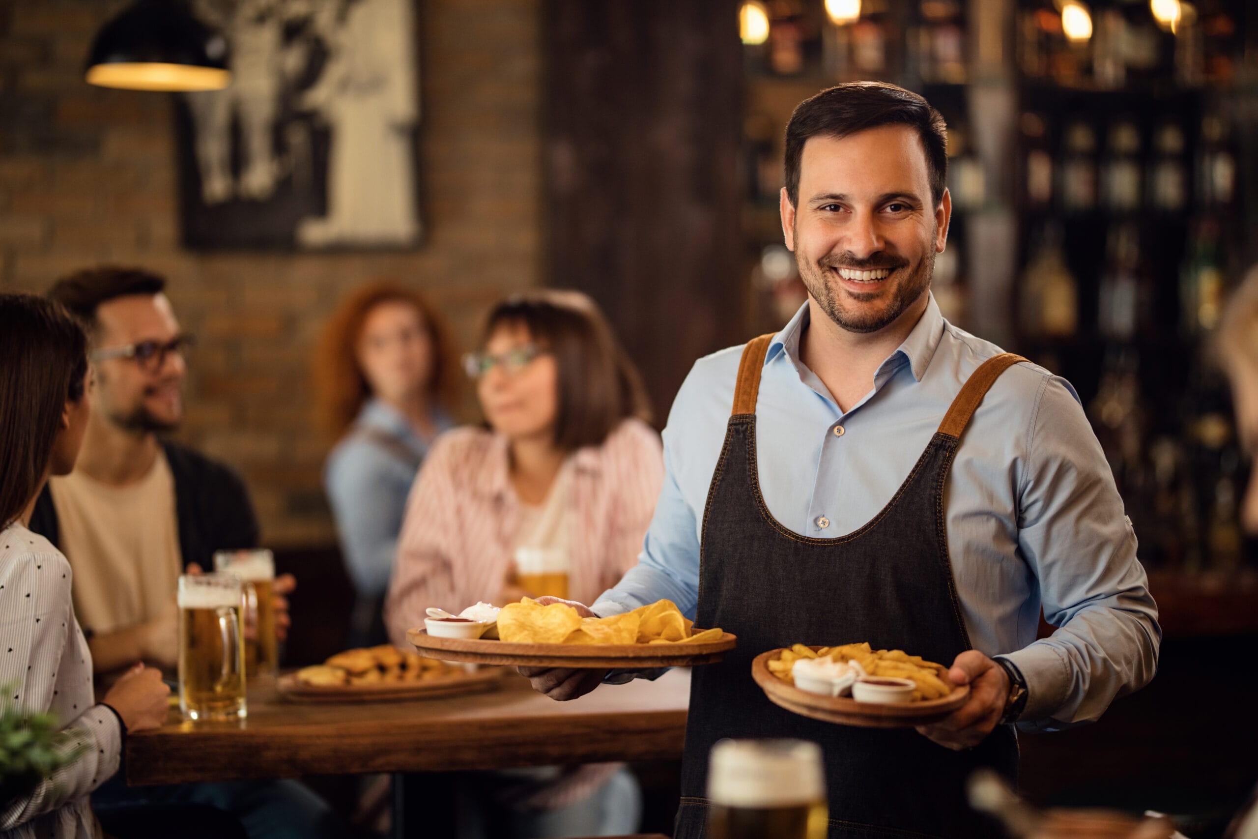 Restaurant cleaning Miami FL — friendly server delivering food in a clean, professionally sanitized dining room