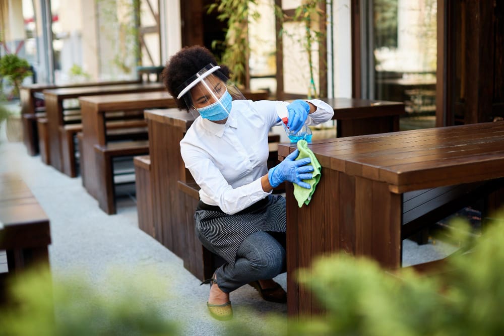 Cleaner servicing an outdoor restaurant patio in Los Angeles